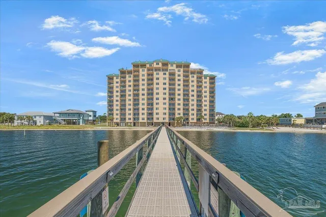 a view of swimming pool with a table and chairs