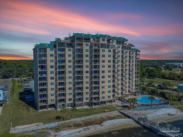 a front view of a building with a yard