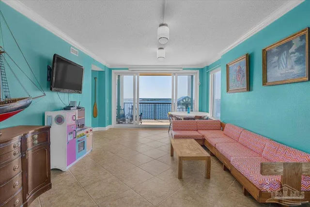 a reading room with furniture and a flat screen tv