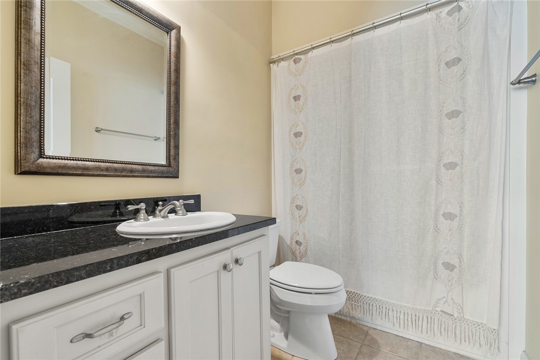 16 Oleander Drive Anderson, SC 29621 - Photo 30 of 37 Granite counters and a clean white vanity offer a fresh look to this well-appointed bathroom.