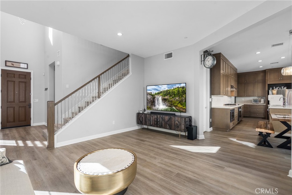 20809 Acorn Circle Porter Ranch, CA 91326 - Photo 13 of 57 a living room with furniture and a flat screen tv