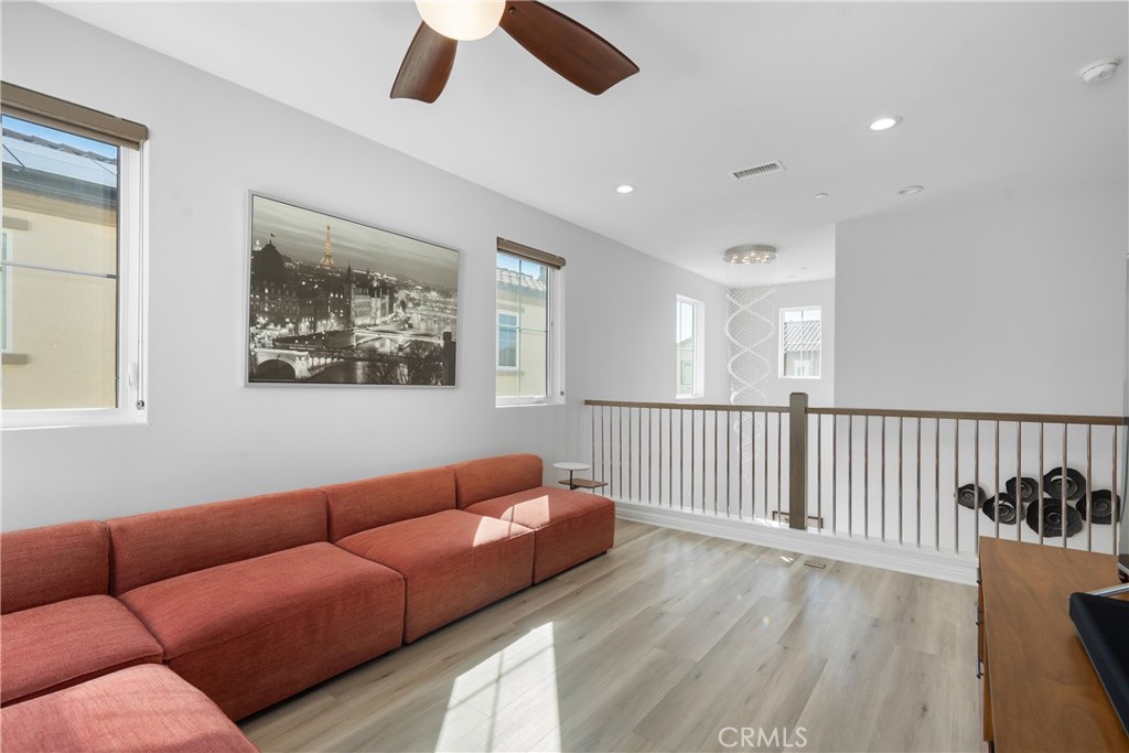 20809 Acorn Circle Porter Ranch, CA 91326 - Photo 16 of 57 a living room with furniture and a wooden floor