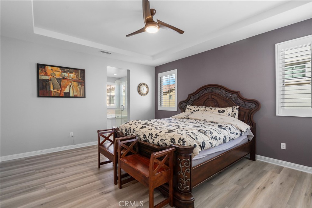 20809 Acorn Circle Porter Ranch, CA 91326 - Photo 19 of 57 a bed sitting in a bedroom next to a window