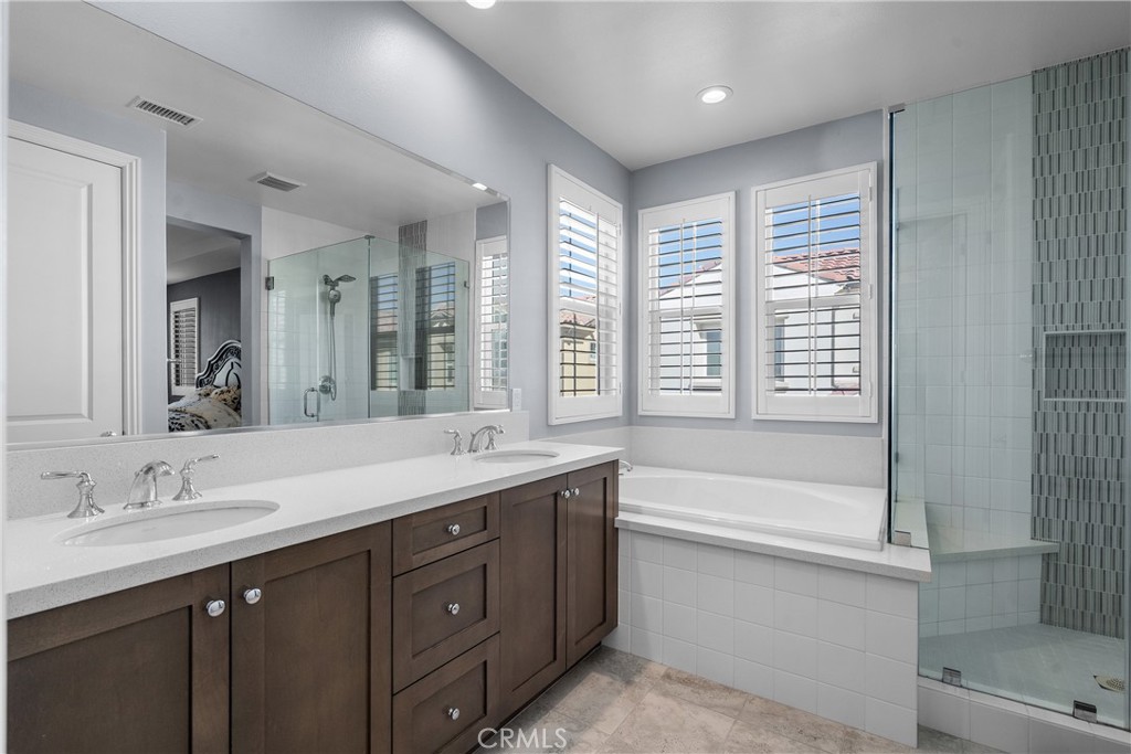 20809 Acorn Circle Porter Ranch, CA 91326 - Photo 21 of 57 a bathroom with a tub sink and mirror