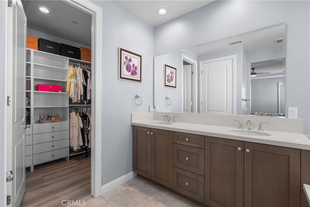 20809 Acorn Circle Porter Ranch, CA 91326 - Photo 22 of 57 a bathroom with a sink vanity and a mirror
