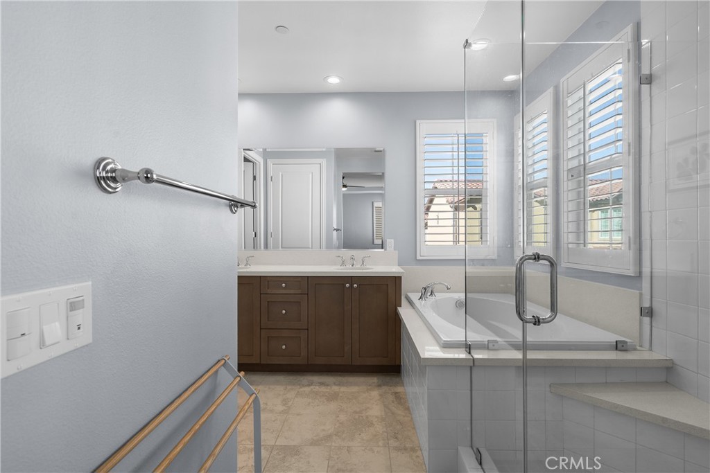 20809 Acorn Circle Porter Ranch, CA 91326 - Photo 23 of 57 a bathroom with a tub sink and mirror