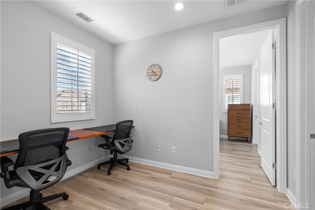 20809 Acorn Circle Porter Ranch, CA 91326 - Photo 26 of 57 a view of a workspace with wooden floor and a window