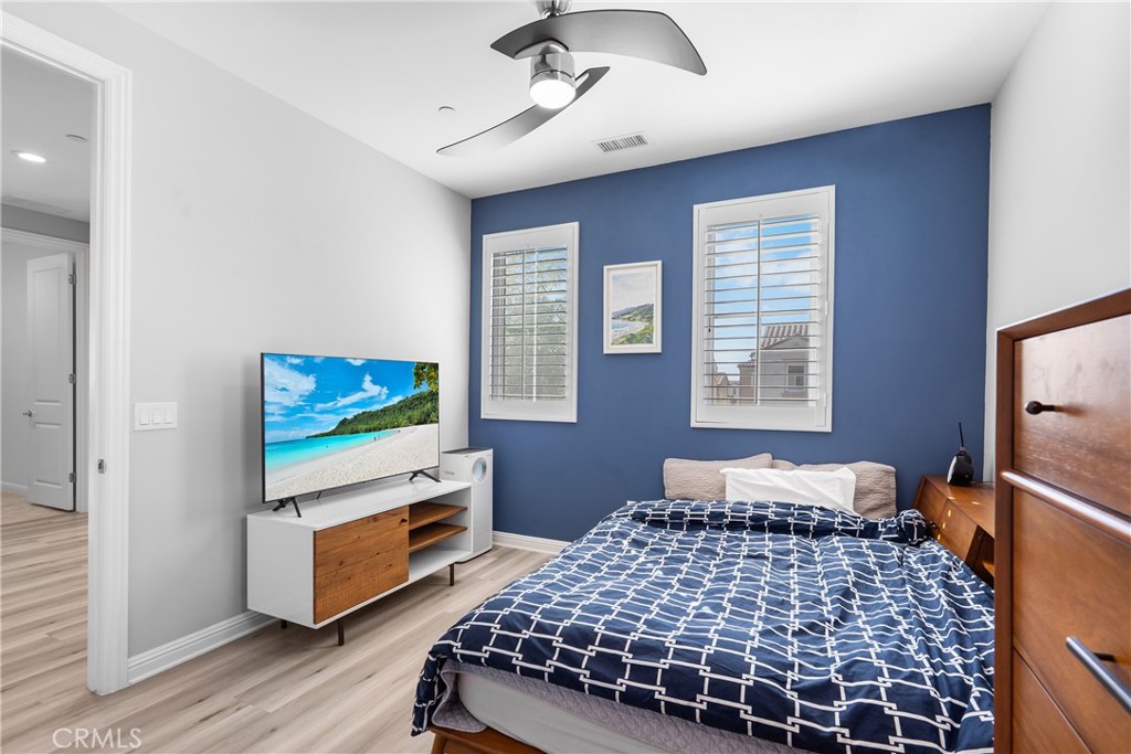 20809 Acorn Circle Porter Ranch, CA 91326 - Photo 27 of 57 a bedroom with bed tv and wooden floor