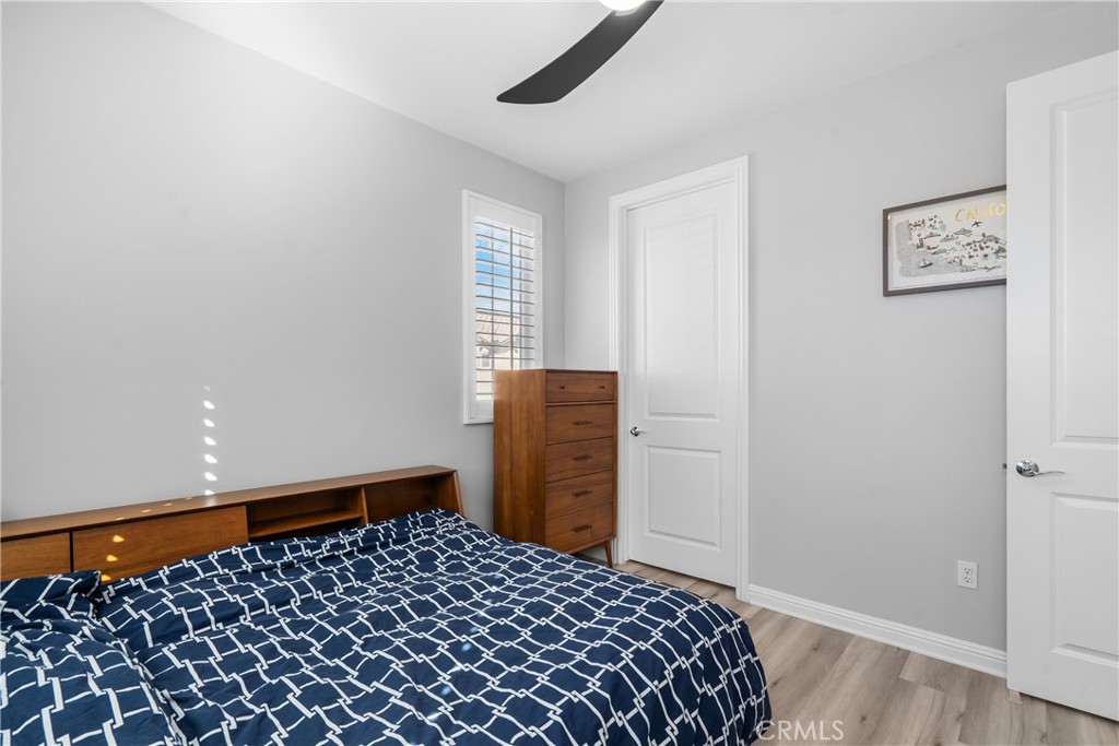 20809 Acorn Circle Porter Ranch, CA 91326 - Photo 28 of 57 a bedroom with a bed and wooden floor