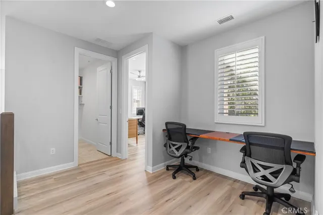 a bedroom with a bed and chair