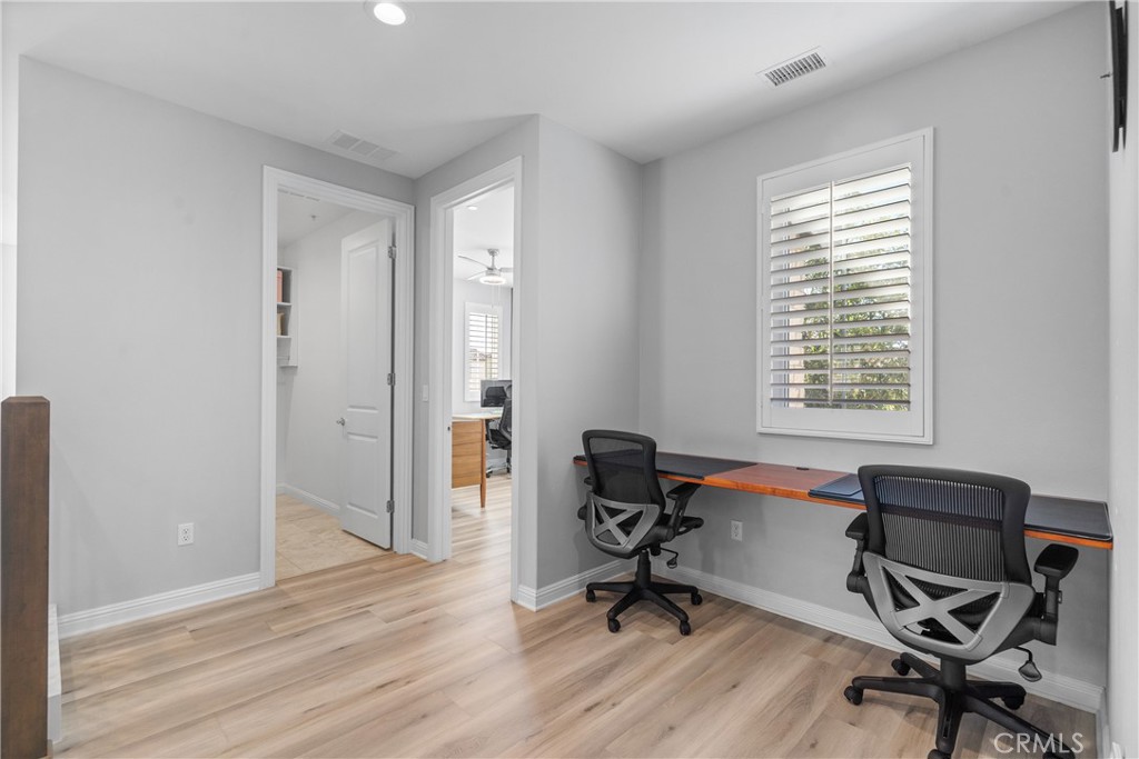 20809 Acorn Circle Porter Ranch, CA 91326 - Photo 31 of 57 a view of a workspace with wooden floor and a window