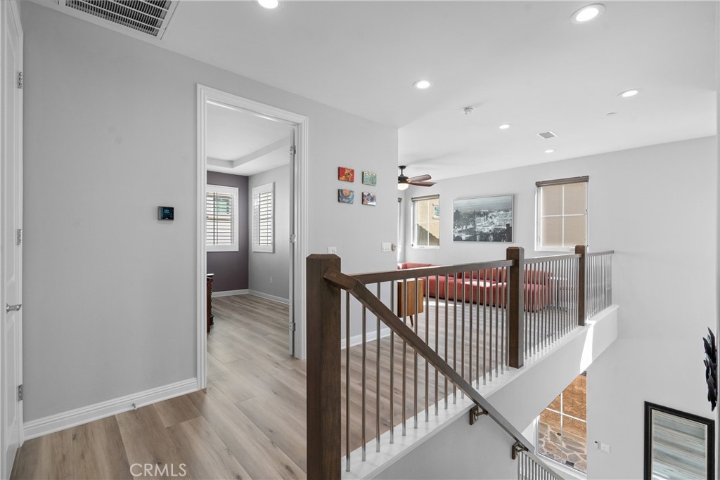 20809 Acorn Circle Porter Ranch, CA 91326 - Photo 32 of 57 a view of a hallway with bedroom and wooden floor