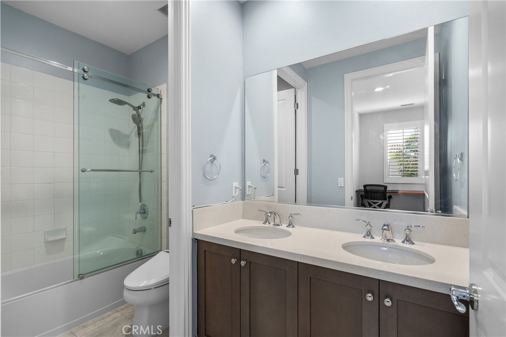 20809 Acorn Circle Porter Ranch, CA 91326 - Photo 35 of 57 a bathroom with a sink a toilet and shower