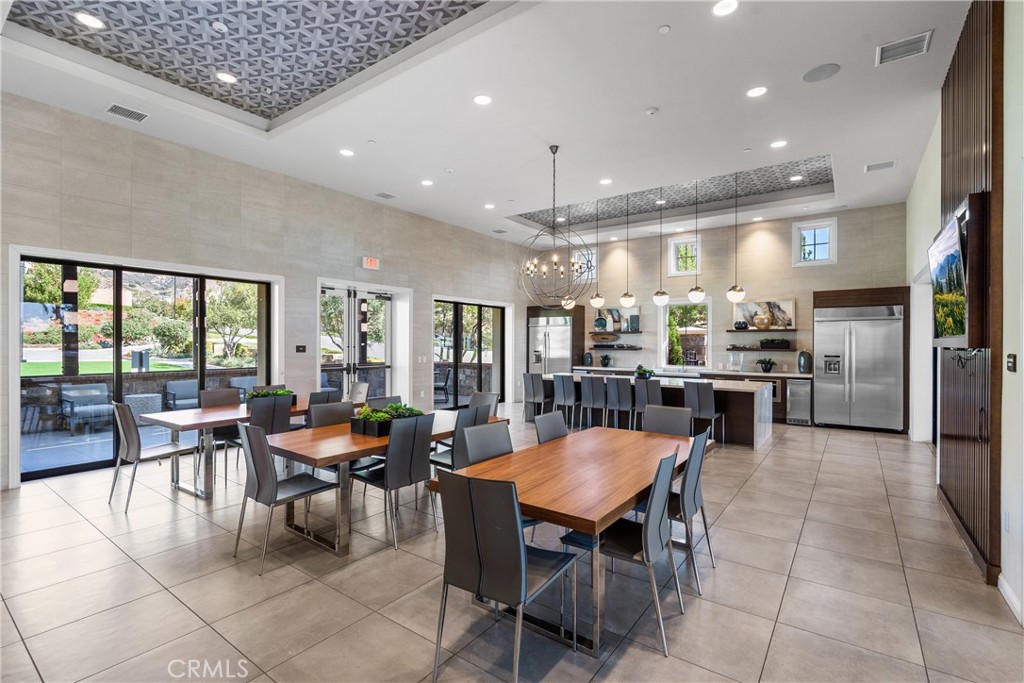 20809 Acorn Circle Porter Ranch, CA 91326 - Photo 48 of 57 a kitchen with a dining table wooden floor stainless steel appliances and dining table