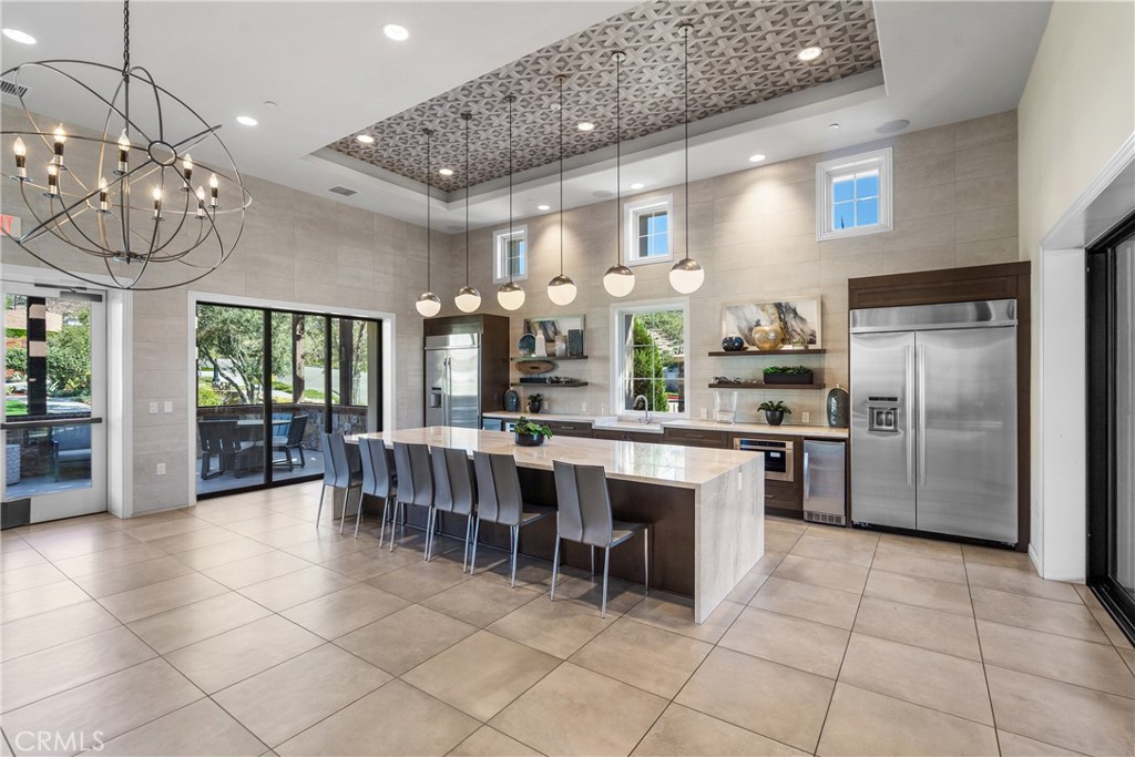 20809 Acorn Circle Porter Ranch, CA 91326 - Photo 49 of 57 a kitchen with stainless steel appliances granite countertop a refrigerator and a sink