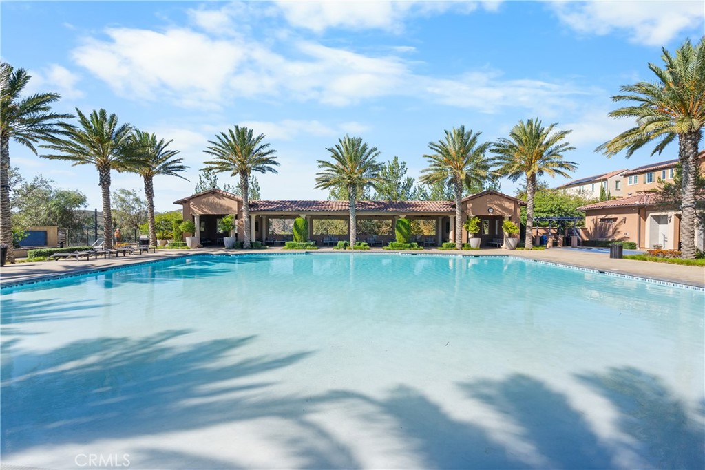 20809 Acorn Circle Porter Ranch, CA 91326 - Photo 51 of 57 a view of swimming pool with outdoor seating and palm trees