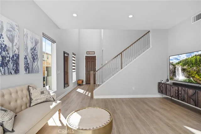 a living room with furniture and large window