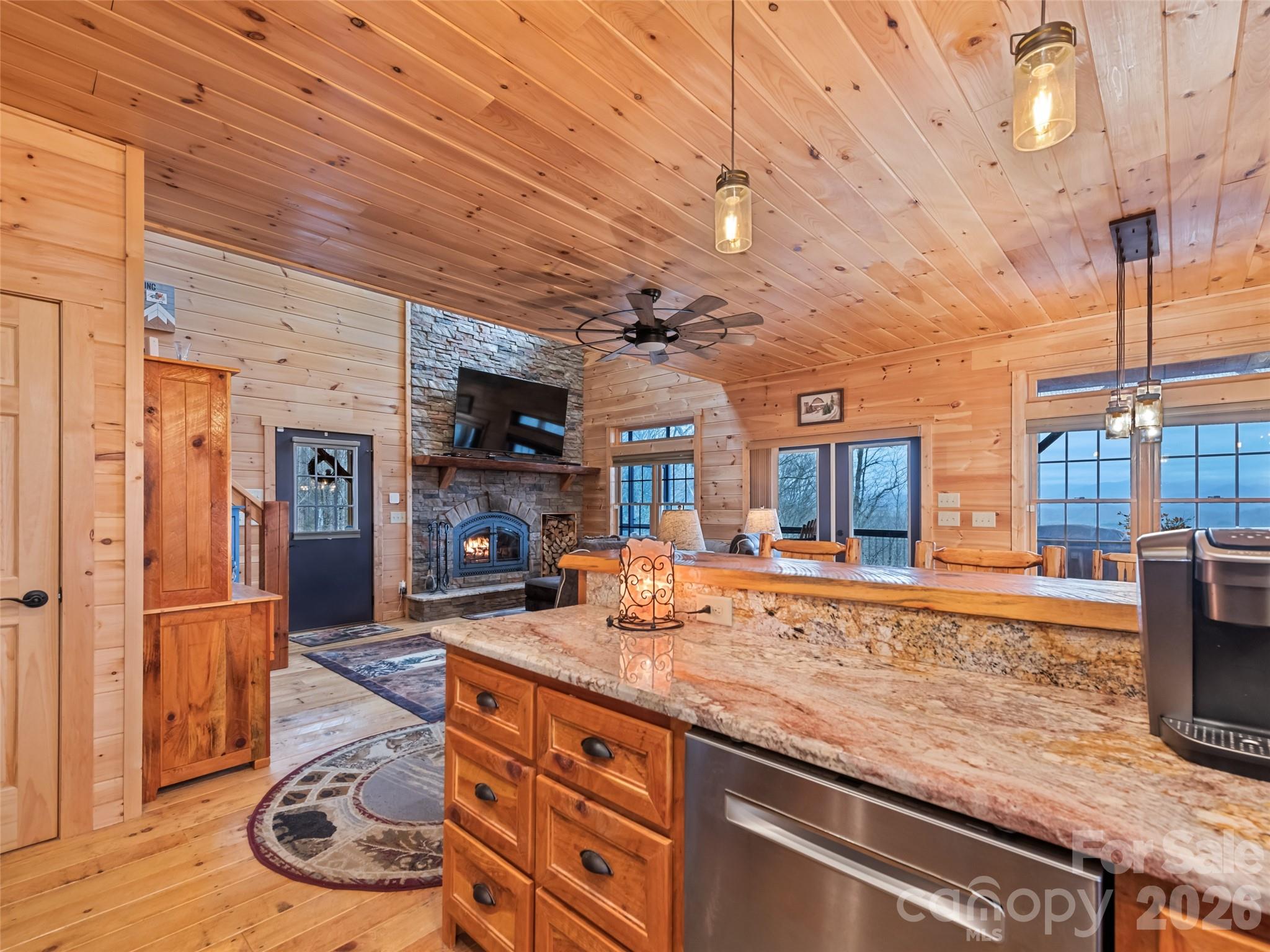 693 High Splendor Drive Robbinsville, NC 28771 - Photo 12 of 48 a dining hall with stainless steel appliances granite countertop a sink and cabinets