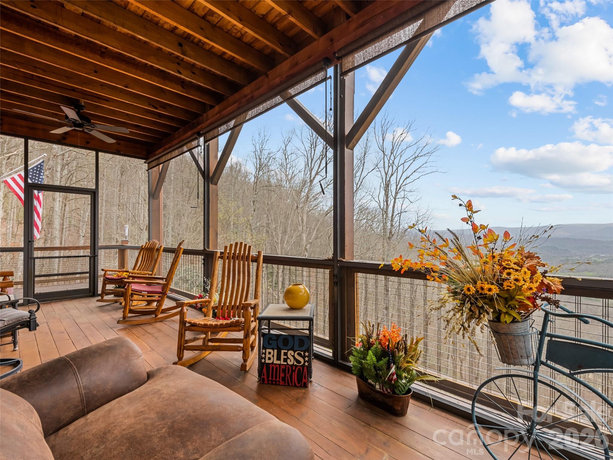 693 High Splendor Drive Robbinsville, NC 28771 - Photo 17 of 48 a roof deck with table and chairs with wooden floor and fence