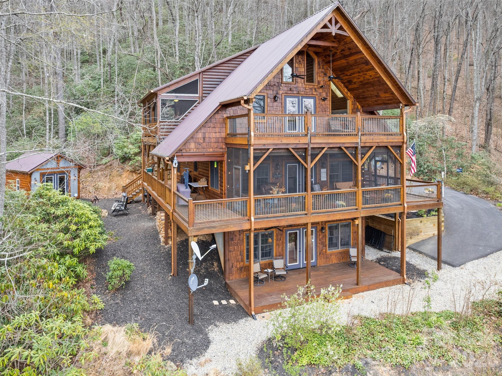 693 High Splendor Drive Robbinsville, NC 28771 - Photo 2 of 48 a view of a house with yard and sitting area