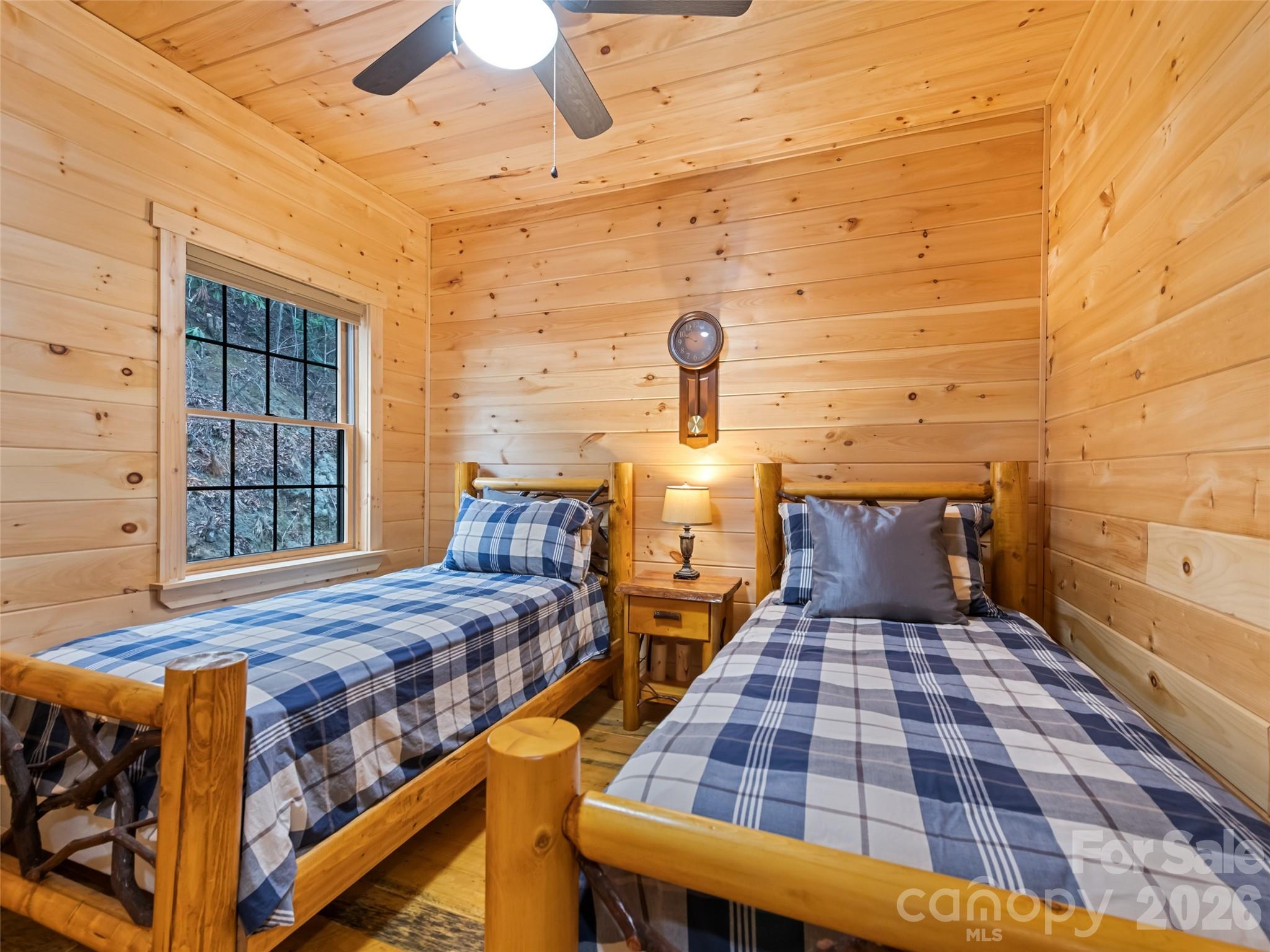 693 High Splendor Drive Robbinsville, NC 28771 - Photo 21 of 48 a bedroom with a bed and wooden floor