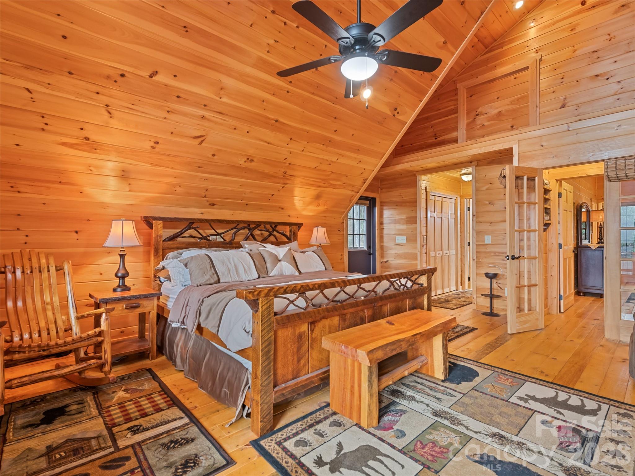 693 High Splendor Drive Robbinsville, NC 28771 - Photo 25 of 48 a bedroom with a bed and wooden floor
