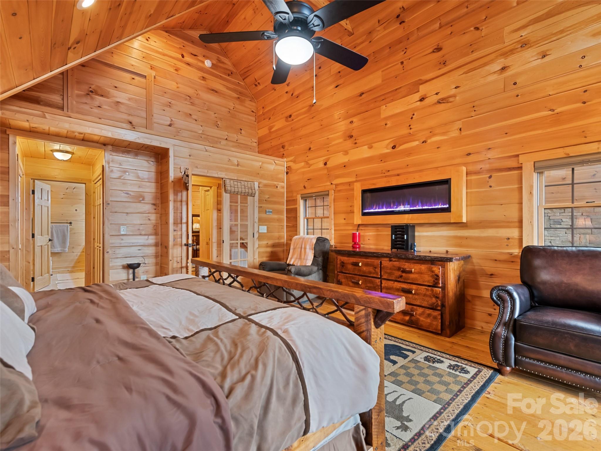 693 High Splendor Drive Robbinsville, NC 28771 - Photo 26 of 48 a bedroom with furniture and a flat screen tv