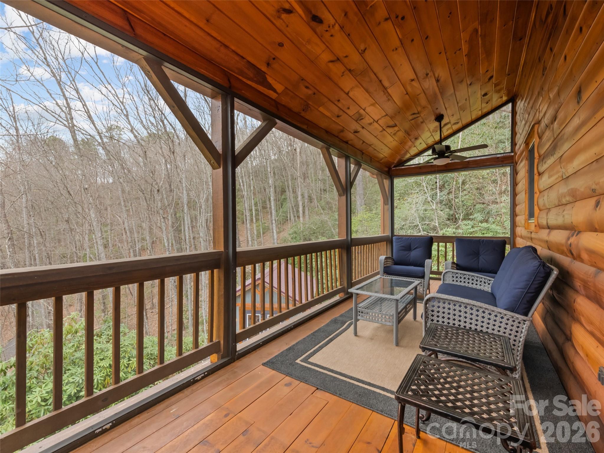 693 High Splendor Drive Robbinsville, NC 28771 - Photo 30 of 48 a balcony with wooden floor and outdoor seating