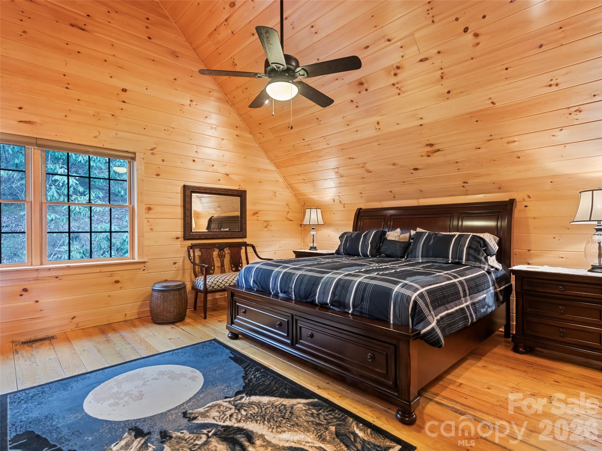 693 High Splendor Drive Robbinsville, NC 28771 - Photo 31 of 48 a bedroom with a bed and wooden floor