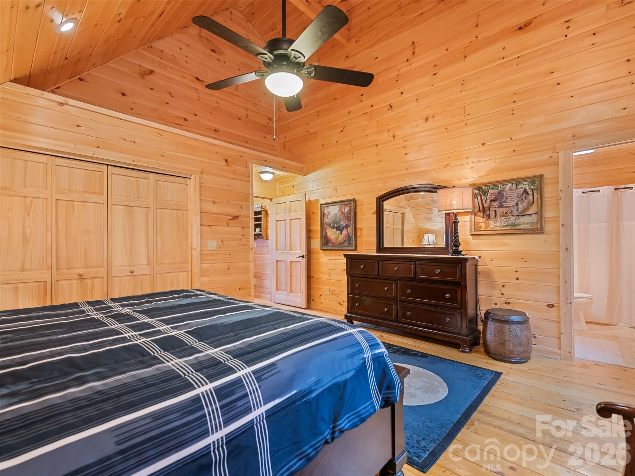 693 High Splendor Drive Robbinsville, NC 28771 - Photo 32 of 48 a bedroom with a bed and wooden floor