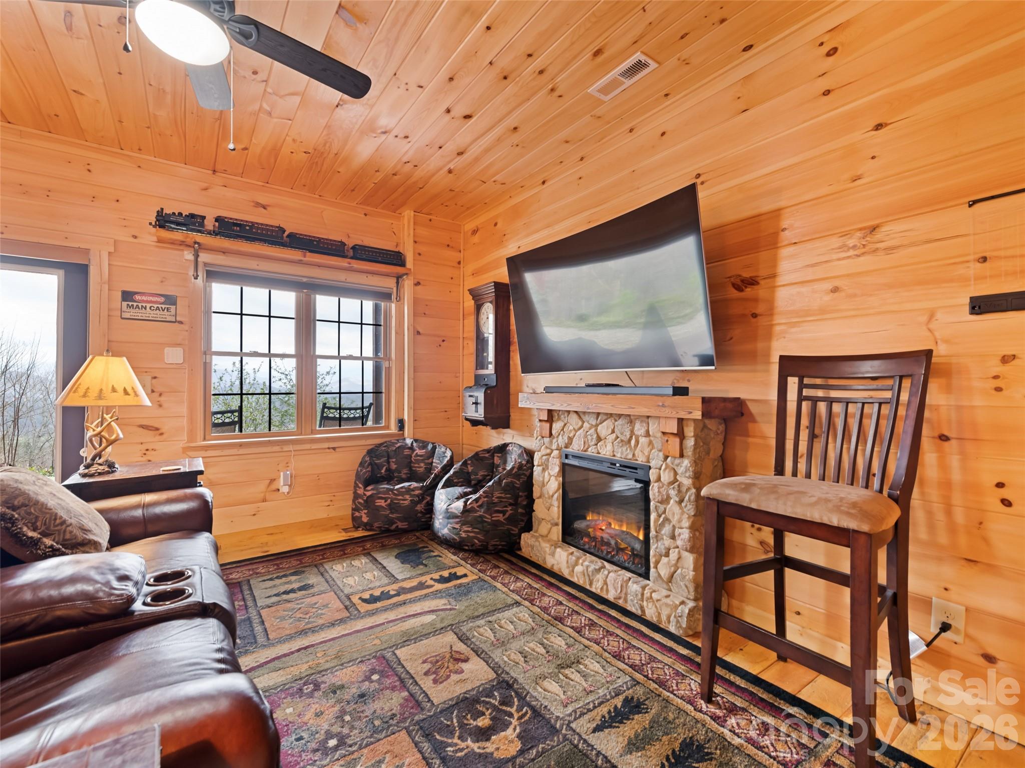 693 High Splendor Drive Robbinsville, NC 28771 - Photo 39 of 48 a living room with furniture and a flat screen tv