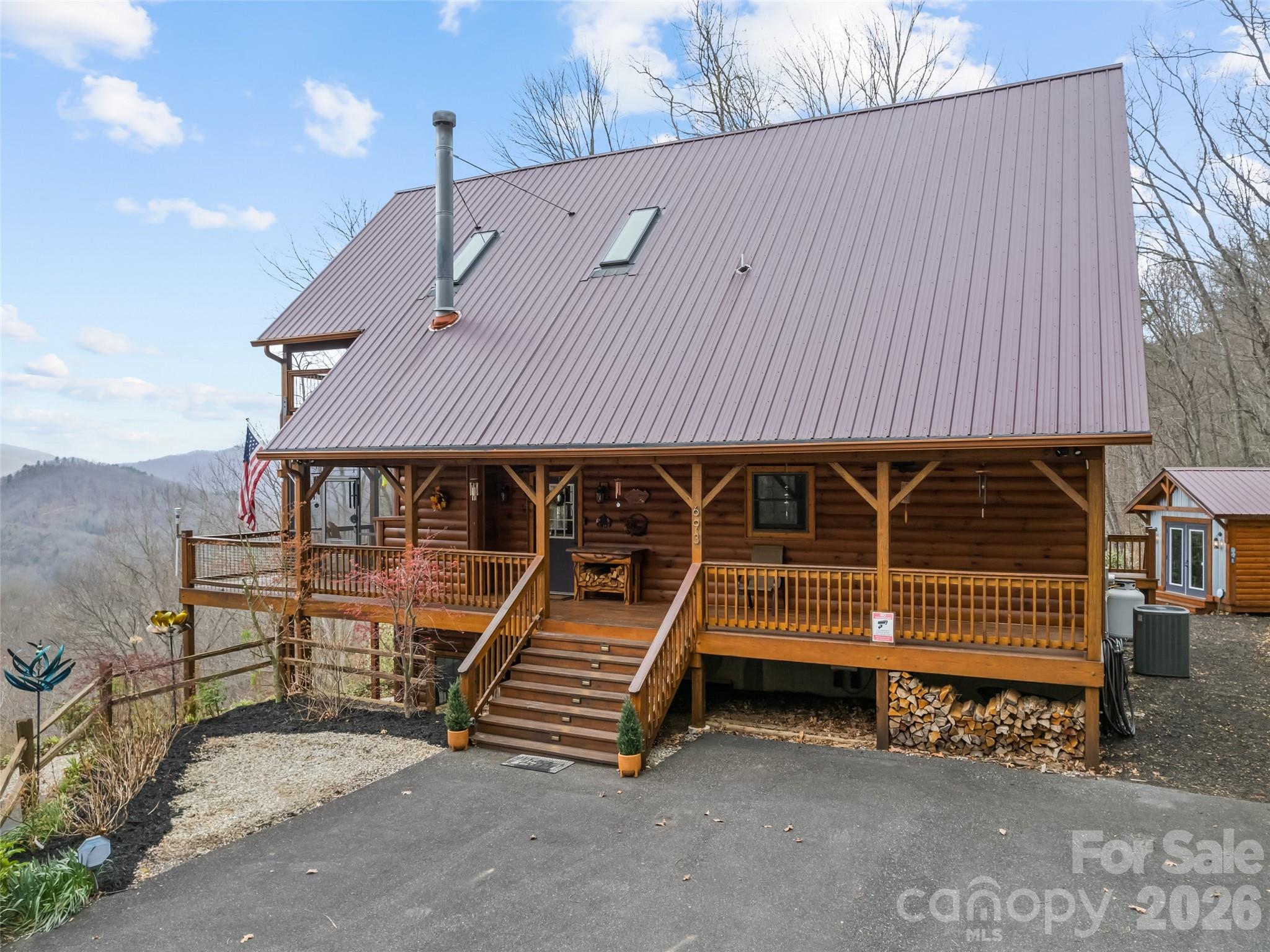 693 High Splendor Drive Robbinsville, NC 28771 - Photo 43 of 48 a front view of a house with a garage