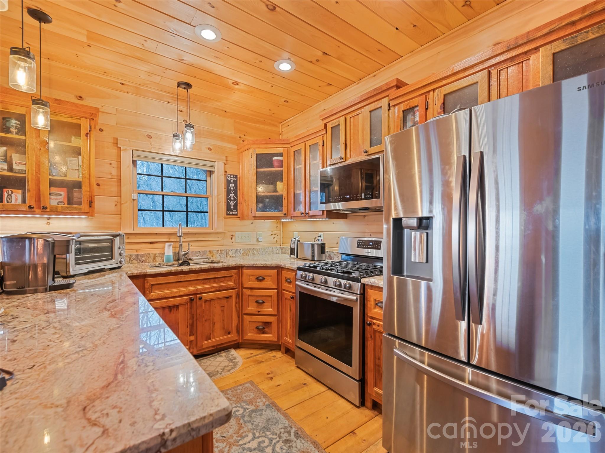 693 High Splendor Drive Robbinsville, NC 28771 - Photo 10 of 48 a kitchen with stainless steel appliances granite countertop a refrigerator a stove and a sink