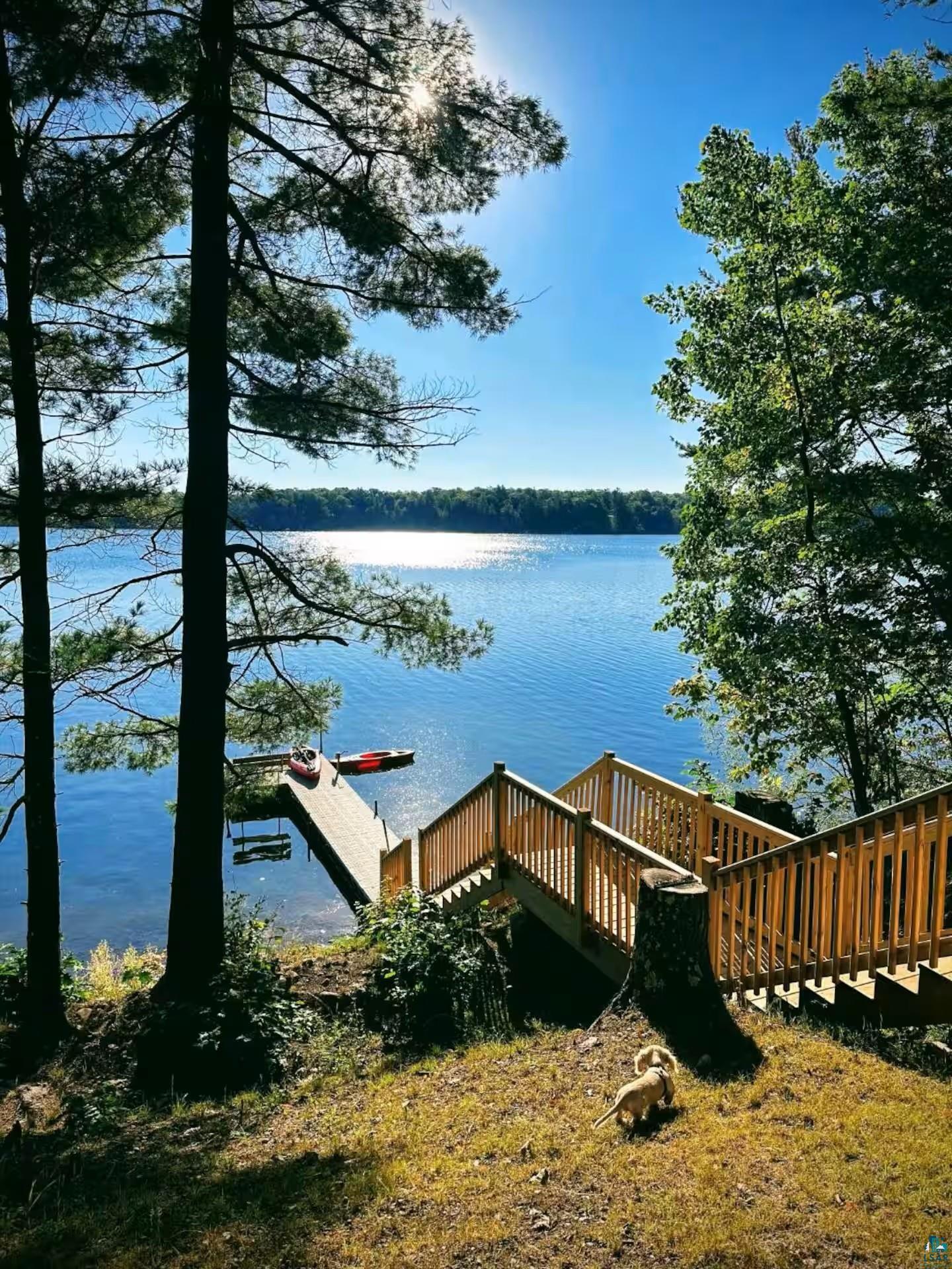 2000 West Chub Lake Road Carlton, MN 55718 - Photo 21 of 30 Waterfront property featuring extensive wood decking and stairs leading to a private dock