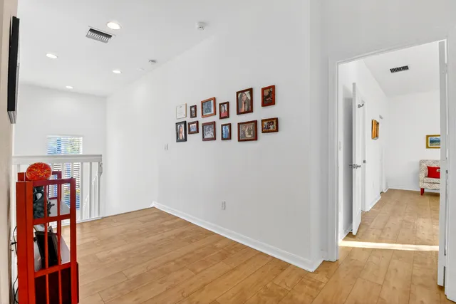 a kitchen with stainless steel appliances granite countertop a sink refrigerator and microwave