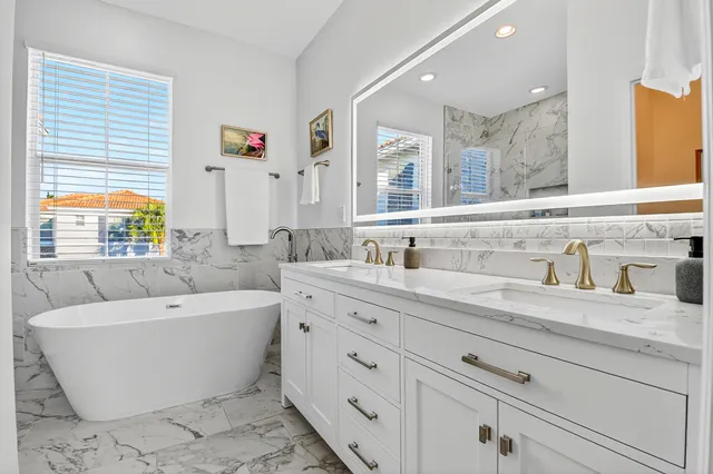 a spacious bedroom with a bed and a window