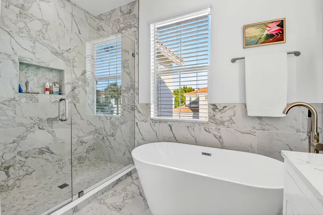 a bed room with a bed and a chair