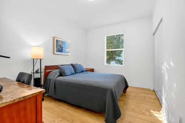 a white bath tub sitting next to a bathroom sink