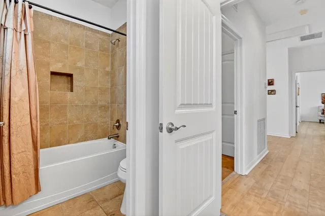 a bedroom with bed and window