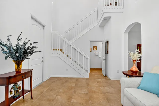 a bedroom with furniture and a window