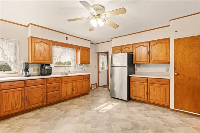 a kitchen with a stove a sink and appliances