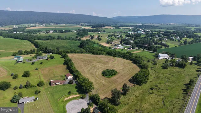 an aerial view of a house with a garden