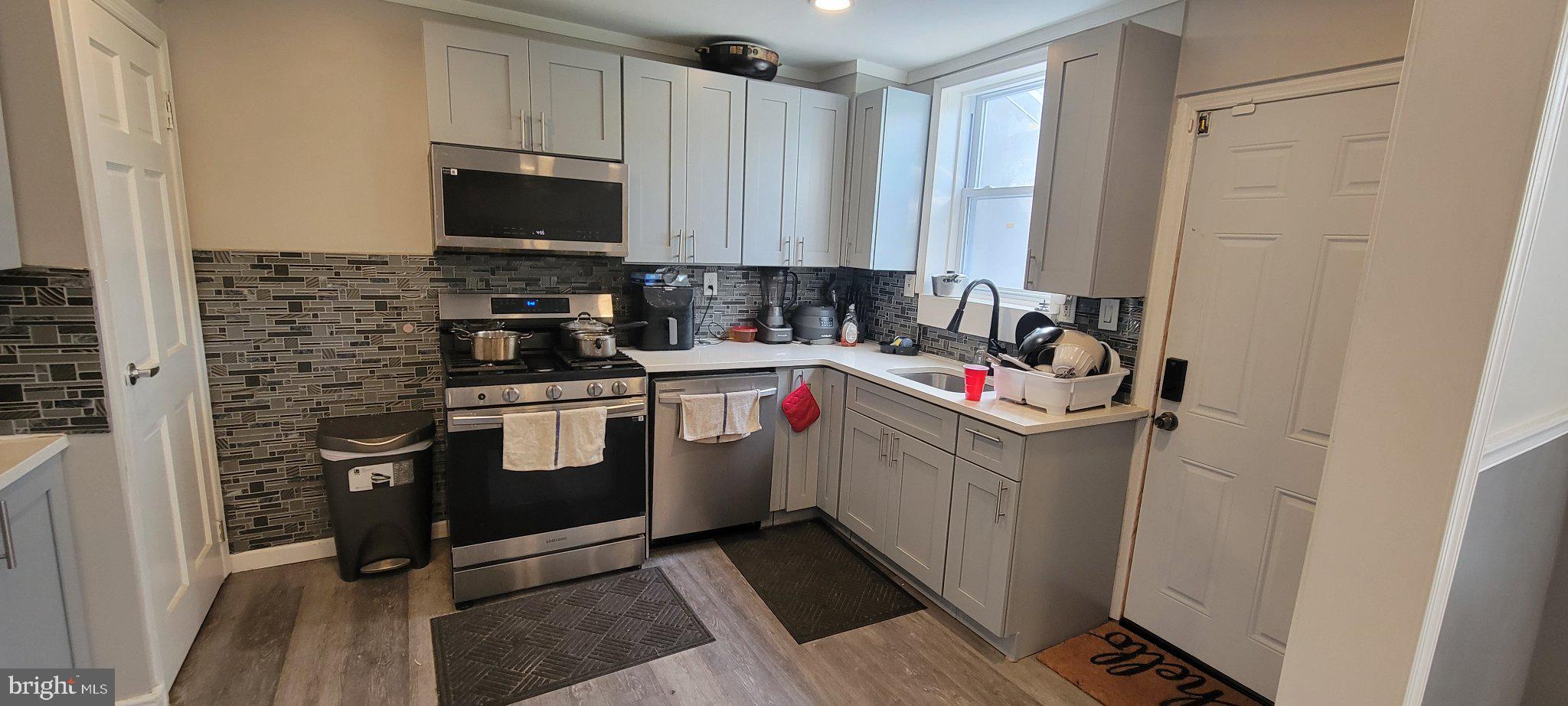 209 North 10th Street Darby, PA 19023 - Photo 9 of 26 Modern kitchen with sleek finishes.
