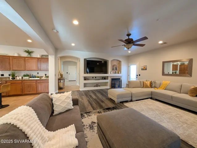 a view of a livingroom with furniture and staircase