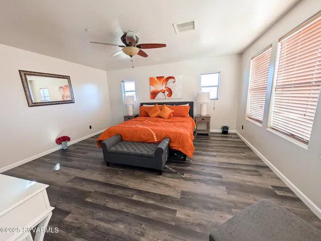 a bedroom with a bed and a table