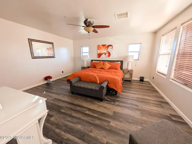 a kitchen with stainless steel appliances kitchen island granite countertop a sink and cabinets
