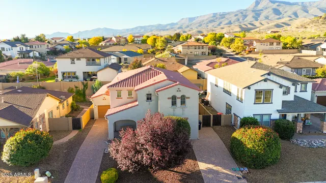 a living room with lots of furniture and kitchen view