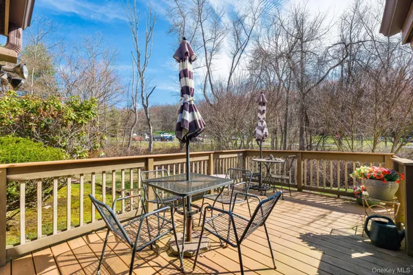 a view of a chair and tables on the roof deck