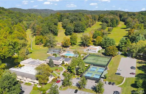 a view of a swimming pool with an outdoor space and seating area