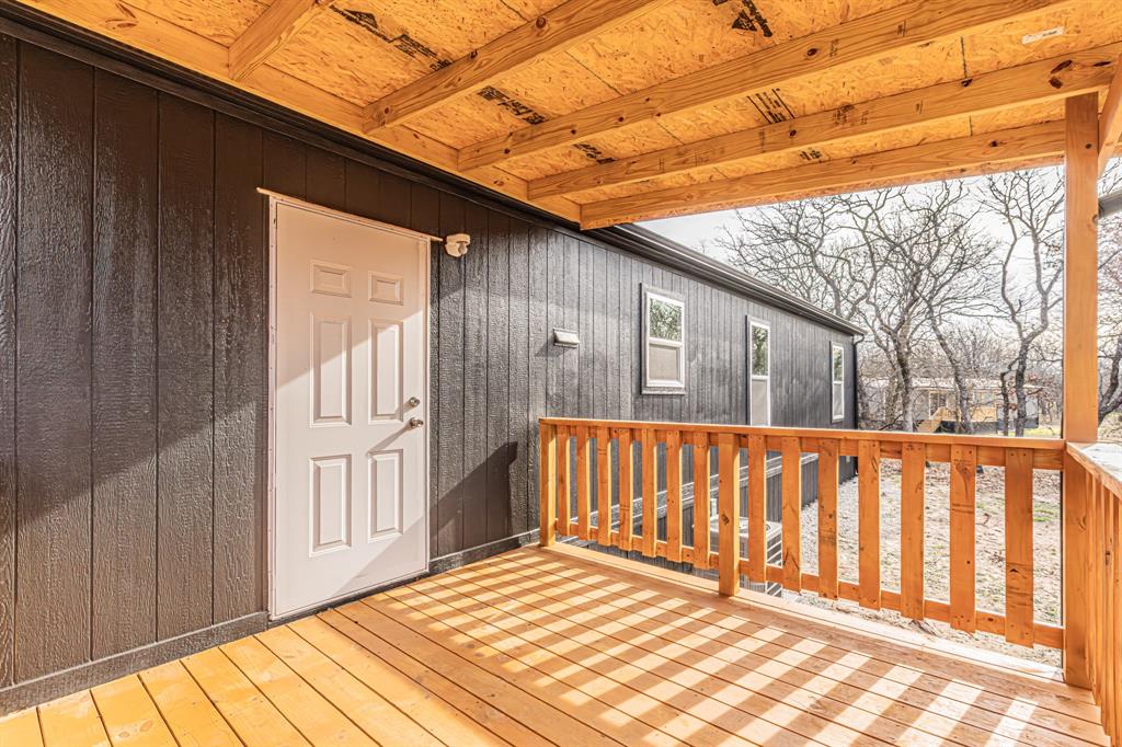 300 Huddleston Road Sunset, TX 76270 - Photo 5 of 40 a view of wooden balcony